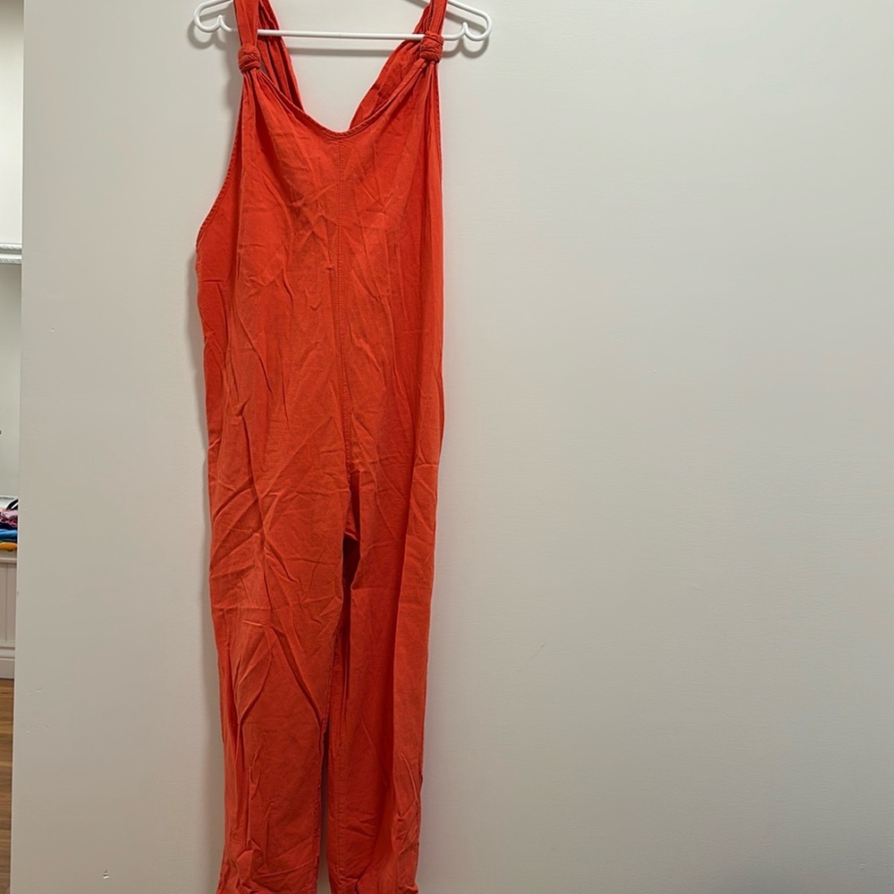 Coral sleeveless jumpsuit.